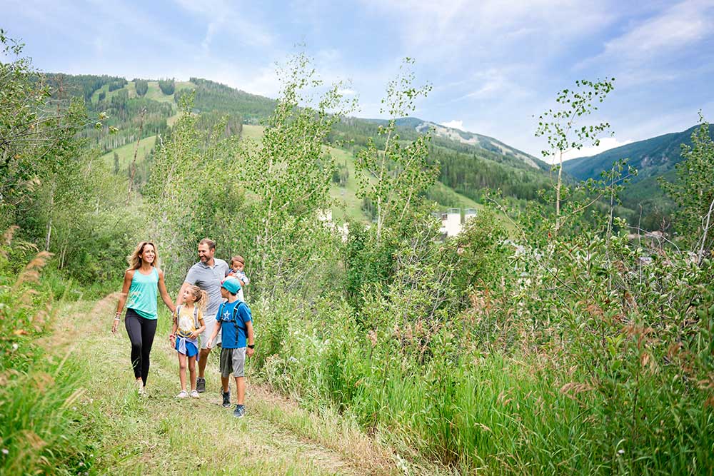 Family hiking in the summer in Beaver Creek, CO