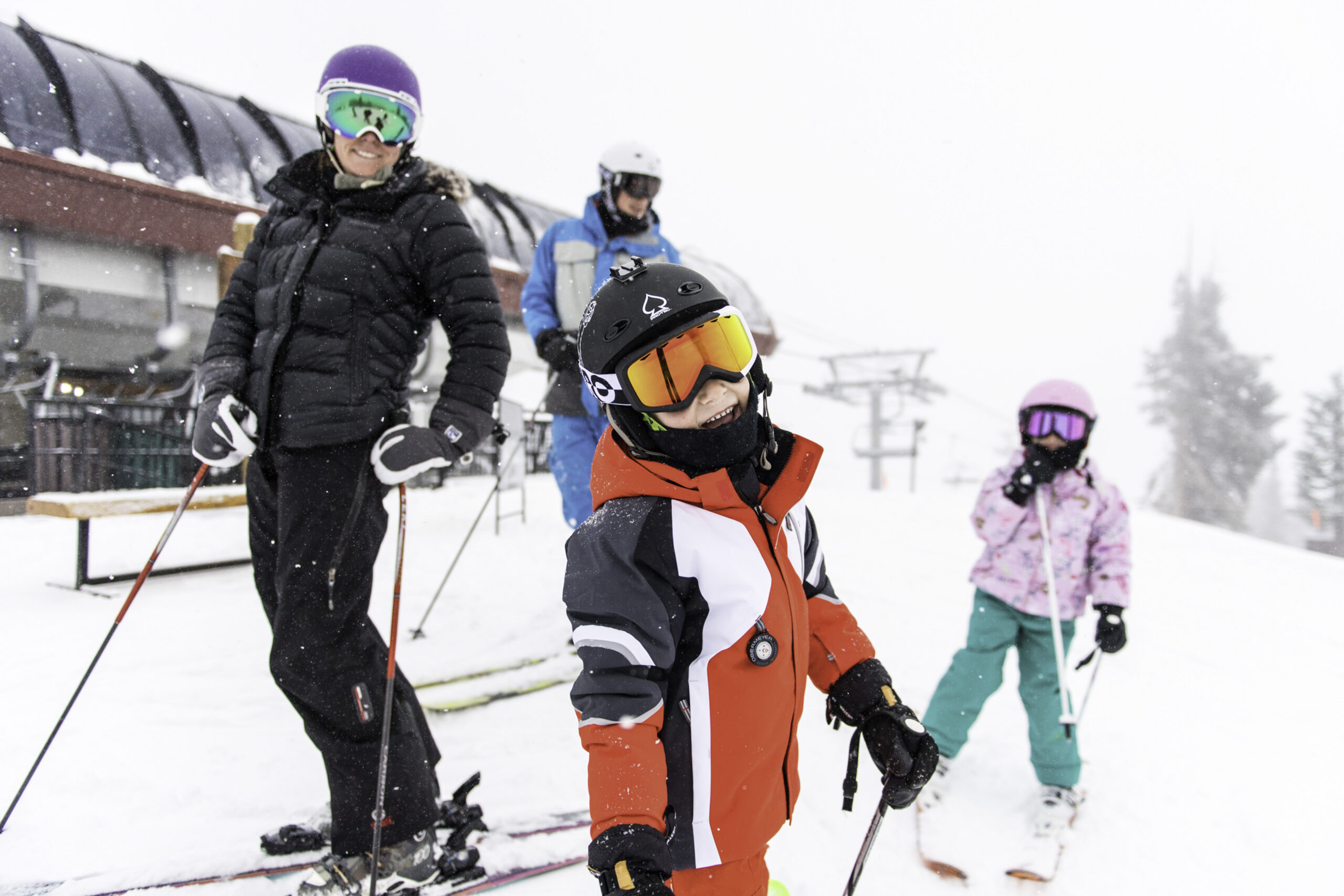 Family skiing on a powder day in Beaver Creek, CO.